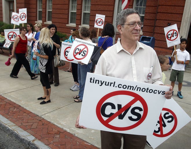Hopkinton Drug Pharmacy owner Dennis Katz joins others in front of the Town Hall to protest the building of a CVS at the old Colella's Supermarket before Tuesday's town meeting in Hopkinton.         Daily News Staff Photo/ Marshall Wolff