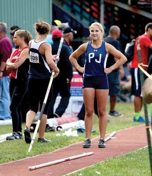 Photo by Daniel Freel/New Jersey Herald — Pope John’s Katlyn Rymarzow waits for her turn in the pole vault event at this year’s Meet of Champions in South Plainfield. Rymarzow took home a gold medal by clearing 12 feet.