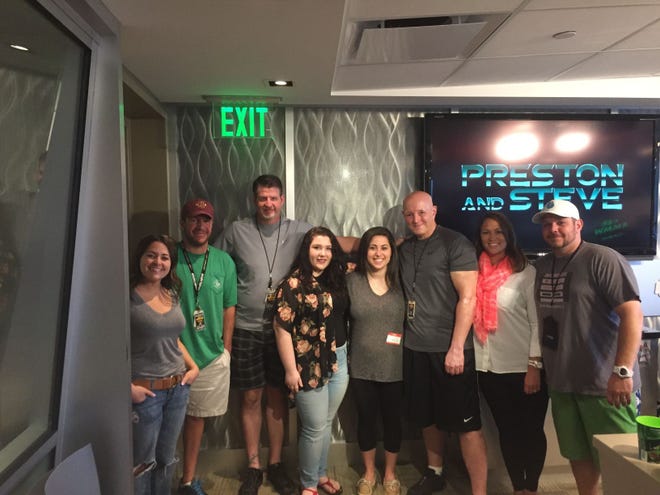 Victoria (center with gray shirt) and her friend Kylie Kennedy (center with flowered shirt) join the "Preston & Steve" crew (from left) Marisa Magnatta, Nick McIlwain, Preston Elliot, Steve Morrison, Kathy Romano and Casey Foster.