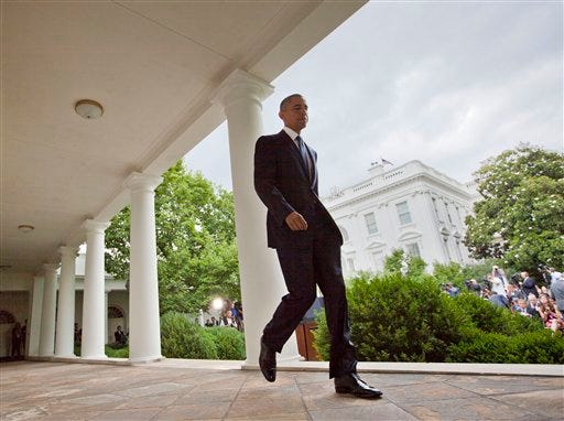 President Barack Obama walks back to the Oval Office after speaking in the Rose Garden of the White House in Washington, Friday, June 26, 2015, after the Supreme Court declared that same-sex couples have the right to marry anywhere in the US. (AP Photo/Pablo Martinez Monsivais)