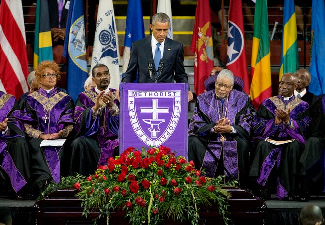 President Barack Obama speaks during services honoring the life of Reverend Clementa Pinckney, Friday, June 26, 2015, at the College of Charleston TD Arena in Charleston, S.C. Pinckney was one of the nine people killed in the shooting at Emanuel AME Church last week in Charleston. (AP Photo/David Goldman)