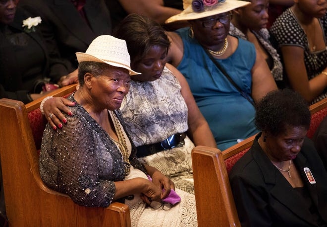 Mourners gather before the funeral service for Ethel Lance, one of the nine people killed in the shooting at Emanuel AME Church last week in Charleston, Thursday, June 25, 2015, in North Charleston, S.C. (AP Photo/David Goldman)
