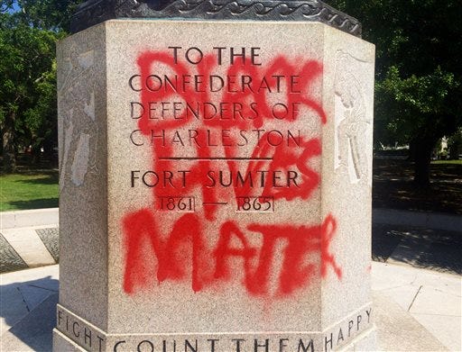 FILE - This June 21, 2015, file photo shows a statue memorializing the Confederacy spray-painted with the message "Black Lives Matter" in Charleston, S.C. Confederate monuments in a half-dozen places this week have been defaced _ a telling sign of the racial tension that permeates post-Ferguson America. (AP Photo/WCSC-TV, Philip Weiss, File)