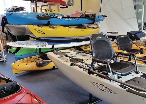 Kayaks and sailboats on display at one of Todd Stevens’s shops on Lake Hopatcong.