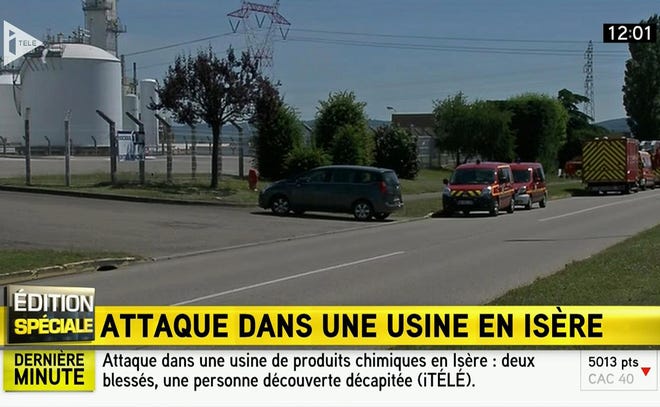 In this screen grab taken from video provided by I Tele, emergency services at the scene outside a factory where a man was allegedly beheaded, in Saint-Quentin-Fallavier, France, Friday.