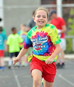 Nancy Loud School's Emily Valliere competes in the girls age 9-10 50-meter dash erarlier this month. Mike Whaley/Fosters.com
