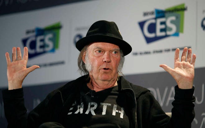 FILE - In this Jan. 7, 2015, file photo, Musician Neil Young speaks during a session at the International CES, in Las Vegas. Advocates like Neil Young and major record labels say the format that's the high end of what's known as "high-resolution" audio restores textures, nuances and tones that listeners sacrifice when opting for the convenience of music compressed into formats like MP3s or Apple's AAC. (AP Photo/John Locher, File)