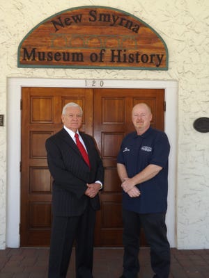 Retired U.S. Air Force Col. Frank Farmer, left, and Robert Redd, executlive director of the New Smyrna Museum of History, stand outside the museum.