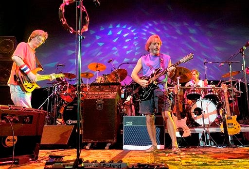 FILE - In this Aug. 3, 2002 file photo, The Grateful Dead, from left, Phil Lesh, Bill Kreutzmann, Bob Weir and Mickey Hart perform during a reunion concert in East Troy, Wis. The group will perform three shows from July 3-5 at Soldier Field in Chicago. (AP Photo/Morry Gash, File)