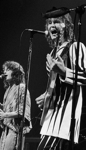 In this Aug. 5, 1977 file photo, bassist Chris Squire, right, and frontman Jon Anderson, of the progressive rock band Yes, perform at New York's Madison Square Garden. Squire, the bassist and co-founder of Yes who recently announced he had leukemia, died Saturday, June 27, 2015, according to a statement from his band members. He was 67.