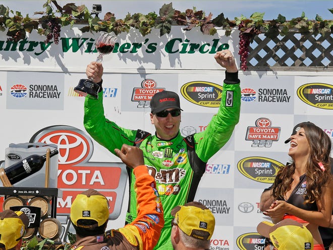 Kyle Busch celebrates after winning the NASCAR Sprint Cup Series race on Sunday in Sonoma, Calif.