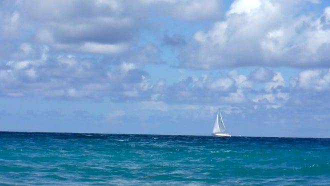 Sailboat off Palm Beach on a sunny June day.