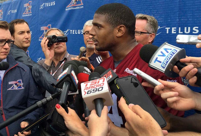 Montreal Alouettes defensive lineman Michael Sam speaks to reporters after returning to practice with the Canadian Football League team Monday, June 29, 2015, in Montreal. Sam, the first openly gay player drafted by an NFL team, could not make the roster of the St. Louis Rams and signed with Montreal. He left the Alouettes for what he said were personal reasons, but returned to the team this week. (AP Photo/Jimmy Golen)