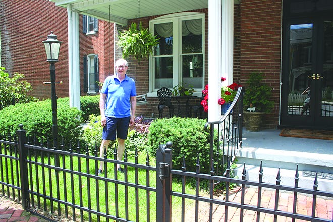 Ron Borg’s fence at 155 S. Washington St. is grandfathered in. He and his wife Jan installed it around 2003 for the aesthetics and to contain their dogs. Five years later the borough outlawed front yard fences, but is reconsidering.