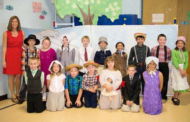 Second-graders in Poland teacher Heather Judd’s class put on a play on June 18 called “A New Beginning,” based on the characters in “Little House on the Prairie.” The students, pictured here after their afternoon performance, from left in the front row are Jared Young, Chloe Rider, Robert Vaughn, Nathan Burns, Emily Smith, Owen Yost and Zyanna Irving-Summers. Pictured from left in the back row are Judd, Jakob Payne, Rayna Malta, Kendra Houghtaling, Caleb Forbes, Sierra Wright, Lily Martin, Derek Milianta, William Pomichter and Maddison Haver. SUBMITTED PHOTO