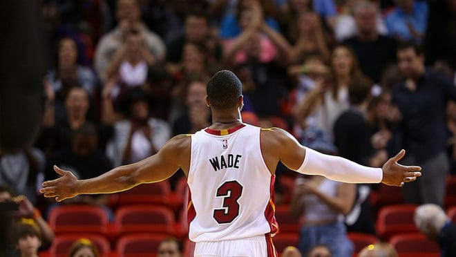 MIAMI, FL - DECEMBER 27: Dwyane Wade #3 of the Miami Heat reacts to the crowd during a game against the Memphis Grizzlies at American Airlines Arena on December 27, 2014 in Miami, Florida. NOTE TO USER: User expressly acknowledges and agrees that, by downloading and/or using this photograph, user is consenting to the terms and conditions of the Getty Images License Agreement. Mandatory copyright notice: (Photo by Mike Ehrmann/Getty Images)