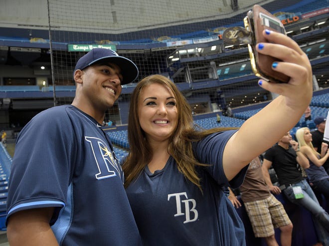 Tampa Bay Rays first-round draft pick Garrett Whitley, left, poses for a photo with Jessica Lenny, of Madeira Beach, after signing his contract before a baseball game against the Cleveland Indians in St. Petersburg., Tuesday, June 30, 2015.