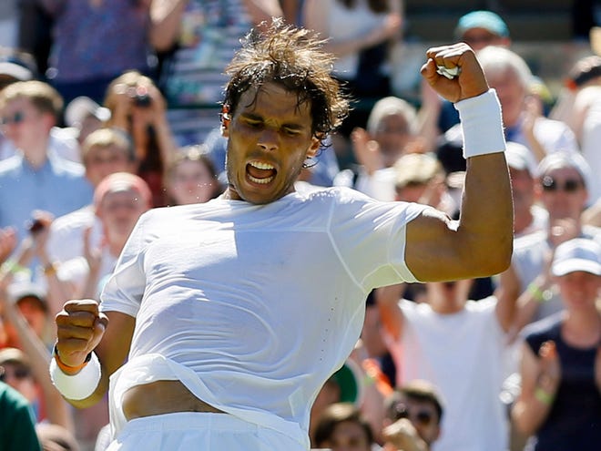 Rafael Nadal of Spain celebrates after defeating Thomaz Bellucci of Brazil in the singles first round match at the All England Lawn Tennis Championships in Wimbledon, London, Tuesday June 30, 2015. Nadal won the match 6-4, 6-2, 6-4.