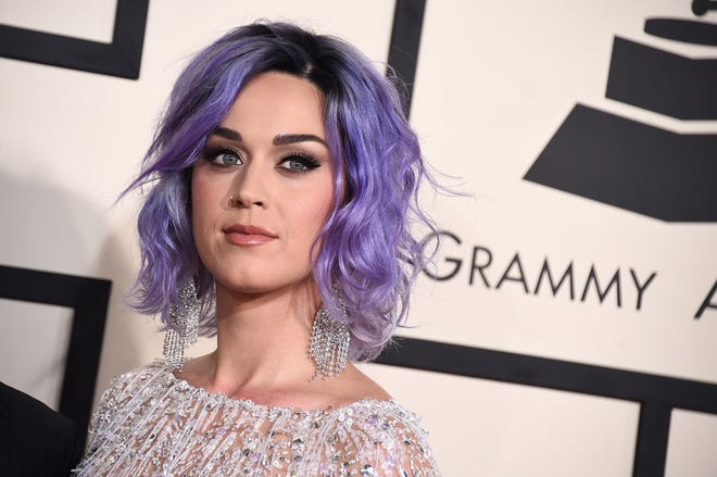 In this Feb. 8, 2015 file photo, Katy Perry arrives at the 57th annual Grammy Awards at the Staples Center in Los Angeles. A dispute between a group of elderly nuns and the Los Angeles Archdiocese over who owns a Hollywood hilltop convent has caught Perry in its crosshairs. The singer is named in a lawsuit filed on June 19, 2015, over the scenic property in the Los Feliz neighborhood of Los Angeles. (Photo by Jordan Strauss/Invision/AP, File)