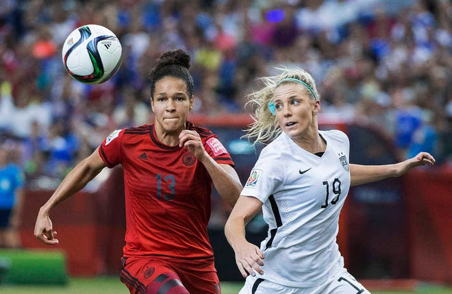 United States' Julie Johnston, right, challenges Germany's Celia Sasic during their semifinal of the Women's World Cup on Tuesday in Montreal, Canada. The United States won 2-0. (Graham Hughes/The Canadian Press via AP)