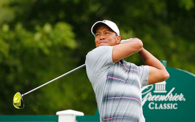 Tiger Woods watches his tee shot on the 12th tee during the pro-am for the Greenbrier Classic PGA tour golf tournament at the Greenbrier Resort in White Sulphur Springs, WV., Wednesday, July 1, 2015. (AP Photo/Steve Helber)
