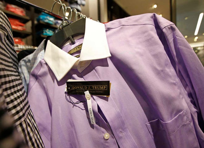 A Donald Trump Signature Collection dress shirt is shown on a rack at Macy's Herald Square flagship store, Wednesday, July 1, 2015, in New York. Macy's became the latest company to end its relationship with presidential candidate Trump after his remarks about Mexican immigrants. (AP Photo/Kathy Willens)