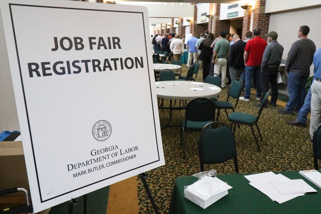 In this April 2, 2015, photo, a crowd gathers for a huge 15-county job fair at The Colonnade in Ringgold, Ga. The Labor Department releases weekly jobless claims on Thursday, June 4, 2015. (Dan Henry/Chattanooga Times Free Press via AP)