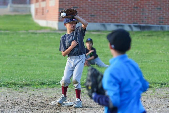 Timmy Knight makes an out at secnd base during a Seacoast Cal Ripken 8-year-old all-star baseball practice on Monday at Tuck Field. Matt Parker/Seacoastonline