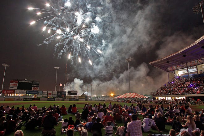 PawSox fans stay to watch the fireworks show after Thursday's game at McCoy Stadium.
