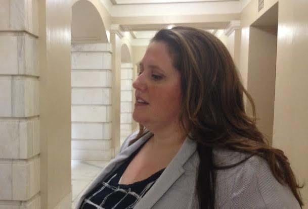 JOHN LYON • ARKANSAS NEWS BUREAU 
Arkansas Health Insurance Marketplace Director Cheryl Smith Gardner talks to reporters after testifying before a legislative panel Wednesday, July 1, 2015.