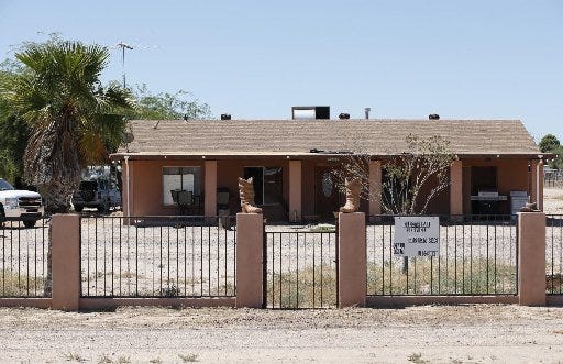 Behind this home the buried bodies of Michael and Tina Careccia, were recovered by police, the home of 38-year-old Jose Valenzuela, who was booked into jail on suspicion of first-degree murder, Pinal County Sheriff Paul Babeu said on Thursday, in Maricopa, Ariz.