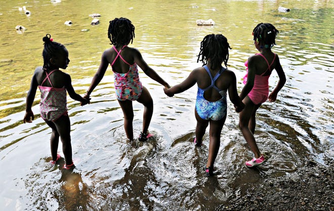 Children wade in the Neshaminy Creek Friday, July 3, 2015, at Tyler State Park in Newtown Township. The Bucks County office of the Penn State Extension is launching a Master Watershed Steward Program and is seeking volunteers dedicated to protecting local water quality.