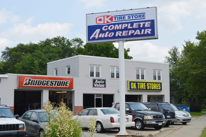 A new sign proclaiming "OK Tire Store: Complete Auto Repair" was erected outside the State Street location of the Holland area franchise in mid-June. It was the first of the four stores to get a new sign — the others will be up before the end of the year. Justine McGuire/Sentinel photo