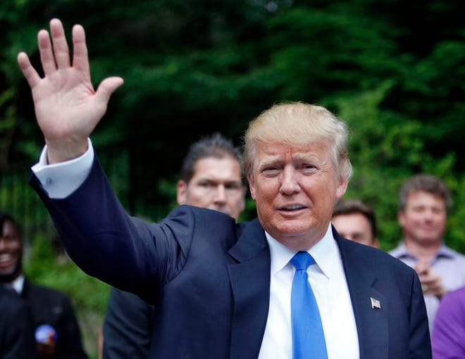 In this June 30, 2015, photo, Republican presidential candidate Donald Trump waves as he arrives at a house party in Bedford, N.H. Hispanic leaders are warning of harm to Republican White House hopes unless the partyâ€™s presidential contenders do more to condemn Trump, whoâ€™s refusing to apologize for calling Mexican immigrants rapists and drug dealers. (AP Photo/Jim Cole)