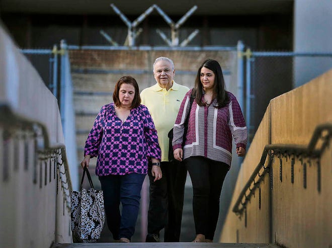 Dr. Salomon Melgen, center, exits the Palm Beach County jail with his wife Flor, left, and daughter Melissa, right, Thursday, July 2, 2015, in West Palm Beach, Fla., after U.S. Magistrate Judge James Hopkins approved an $18 million bond package, allowing the eye surgeon to go home to await trial. Melgen has been held more than 11 weeks since his arrest in a sweeping Medicare fraud case. It is separate from the corruption case he faces with Sen. Bob Menendez in New Jersey. (Damon Higgins/The Palm Beach Post via AP) MAGAZINES OUT; TV OUT; NO SALES