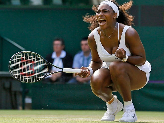 Serena Williams of the United States celebrates winning a point against Heather Watson of Britain, during their singles match at the All England Lawn Tennis Championships in Wimbledon, London, Friday July 3, 2015.