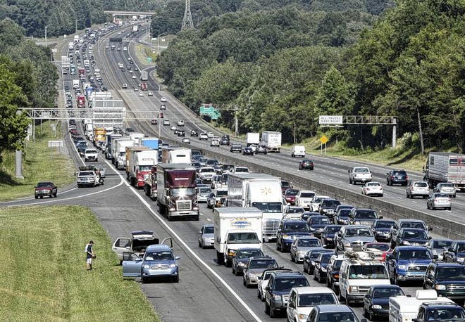 Traffic moves at a snail's pace on Southbound I-85 as seen from the exit 27 bridge in Belmont on July 1, 2011. The already congested area will likely get worse as more and more commuters from southeast Gaston who work in Charlotte jump onto the interstate in Belmont.