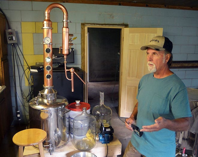 Ray Stuyvesant, a farmer in Caton, talks about his business, Whiskey Creek Distilling at his farm Thursday afternoon. Eric Wensel/The Leader