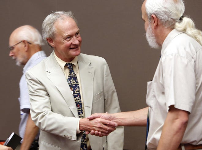 Former Rhode Island governor and Democratic presidential hopeful Lincoln D. Chafee meets Belknap County Democrats during a recent campaign stop in Laconia, New Hampshire.  AP/Jim Cole