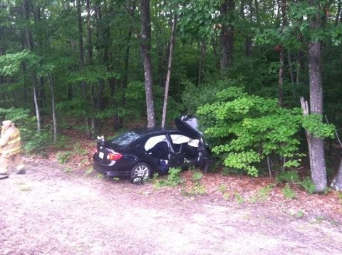 A vehicle ended up along the tree line after a two-car crash Saturday in Rochester. Photo courtesy of Rochester Police Department.