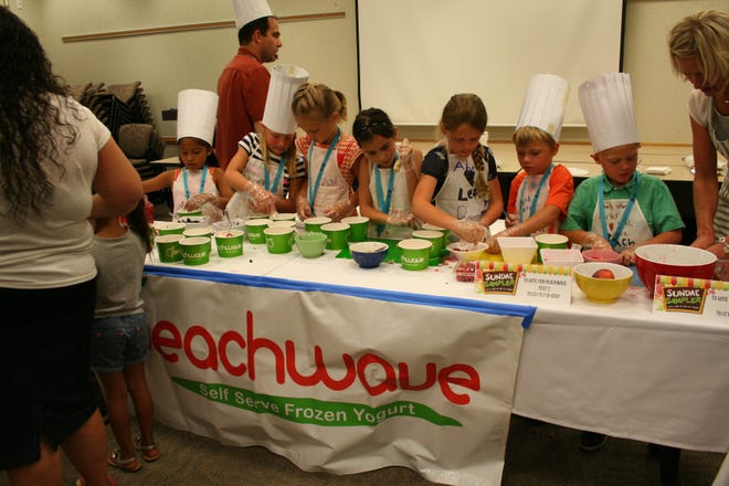 Team Peachwave — students from Holland West and Rose Park Christian schools — mix up their People's Choice award-winning cookie berry cherry sundae at the OAISD's Sundae School. Contributed.