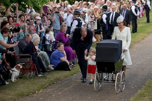 AP Photo/Matt Dunham, Pool
Britain's Prince William, Kate the Duchess of Cambridge, their son Prince George and daughter Princess Charlotte in a pram arrive for Charlotte's Christening at St. Mary Magdalene Church in Sandringham, England.