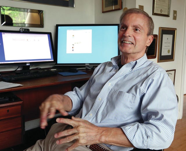 Orlando (Fla.) Sentinel
Dr. Richard Gilson talks June 2, 2015, about the patent he has on a device to improve technology on systems that stimulate the brain to lessen tremors and other symptoms of Parkinson's Disease at his home in Oviedo, Fla.