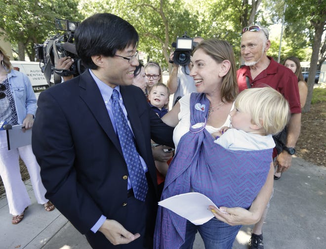 Sen. Richard Pan, D-Sacramento, is thanked by Leah Russin, holding her son Leo, after Pan's measure requiring nearly all California school children to be vaccinated in response to a measles outbreak in Disneyland last year, was signed Tuesday by Gov. Jerry Brown.

AP/Rich Pedroncelli