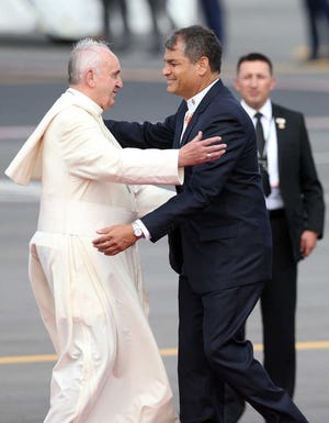 Fernando Llano/APEcuador's President Rafael Correa, right, greets Pope Francis in Quito on Sunday upon his arrival to the Mariscal Sucre International airport.