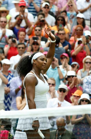 Serena Williams of the United States celebrates winning the singles match against Venus Williams of the United States, at the All England Lawn Tennis Championships in Wimbledon, London, Monday July 6, 2015. Serena Williams won 6-4, 6-3. (AP Photo/Alastair Grant)