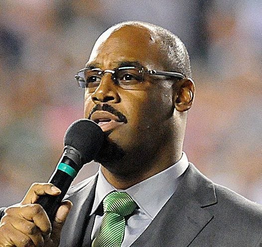 (File) Former Eagles player Donovan McNabb speaks to the crowd at Lincoln Financial Field in 2013 when his jersey number 5 was retired from use.