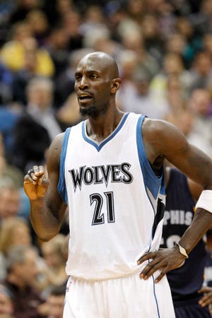 Minnesota Timberwolves forward Kevin Garnett plays in a game against the Memphis Grizzlies on Feb. 28 in Minneapolis. Garnett has agreed to terms on a two-year contract to remain in Minnesota. (AP Photo/Ann Heisenfelt, File)