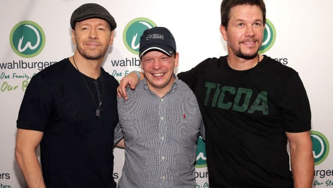 Donnie Wahlberg (from left), Paul Wahlberg and Mark Wahlberg attend the Wahlburgers Coney Island Preview Party on June 23, 2015 in the Brooklyn Borough of New York City. (Photo by Neilson Barnard/Getty Images for Wahlburgers)