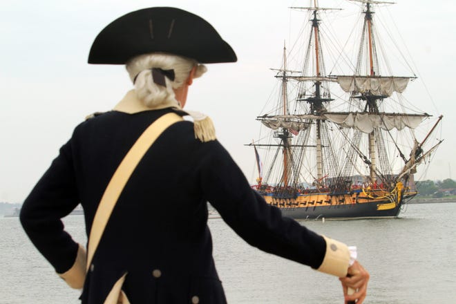 Ron Sullman of East Greenwich, portraying Lt. Col. Jeremiah Olney of the 2nd Rhode Island Regiment, helps welcome a reproduction of the French frigate "Hermione" to Newport Wednesday. The original Hermione had brought the Marquis de Lafayette and French troops to Newport in 1780. The Providence Journal/Bob Breidenbach